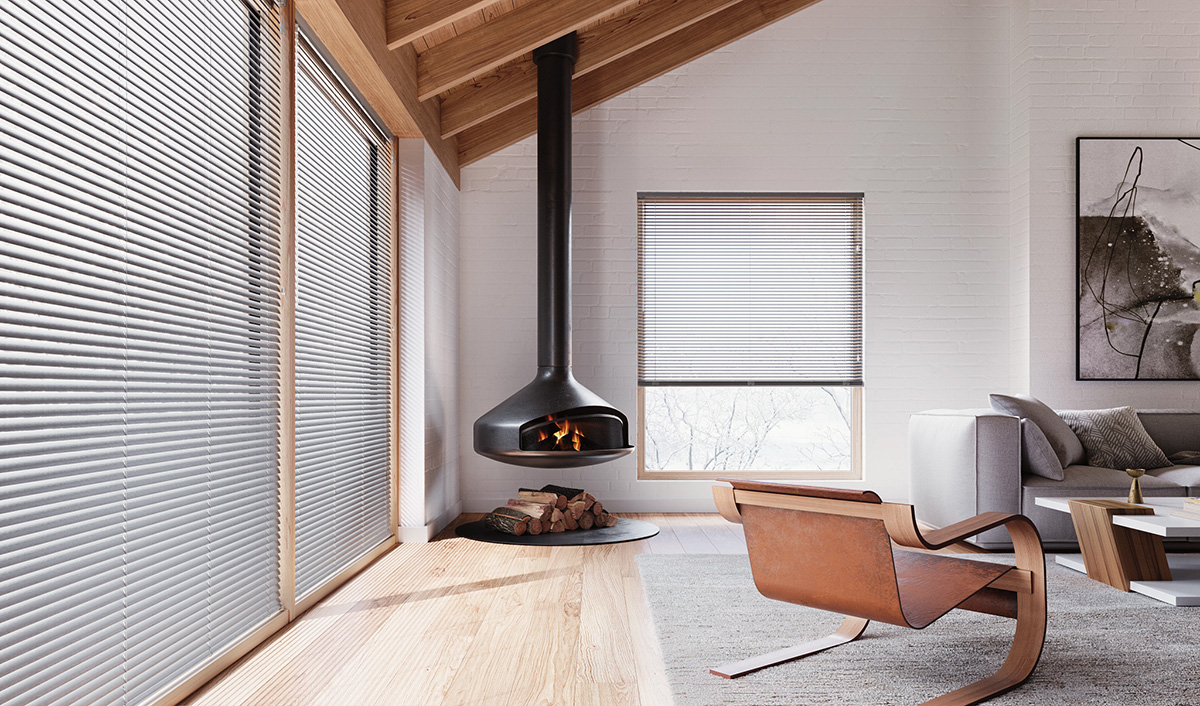 Aluminum blinds letting in light into a living room. 