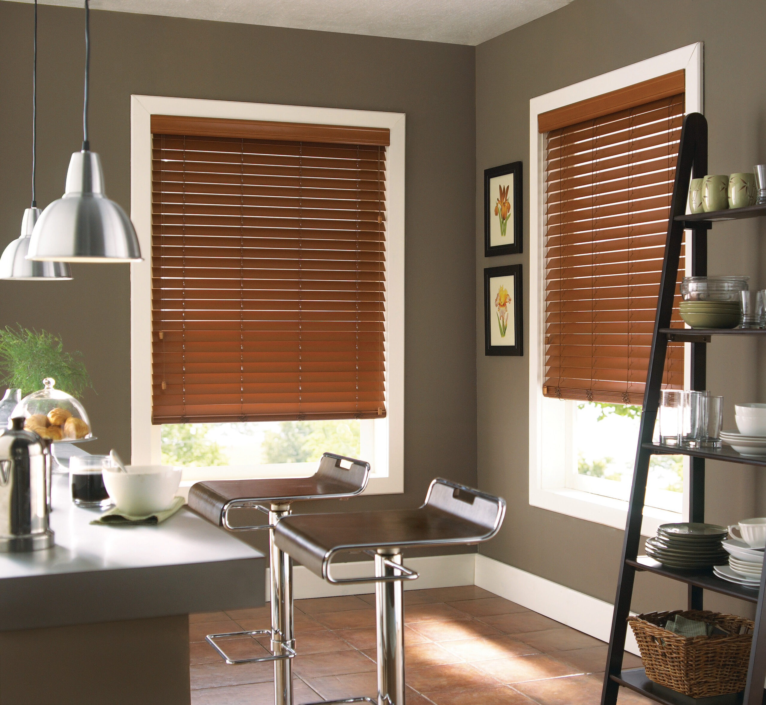 Custom made faux wood blinds filtering in light into a kitchen. 